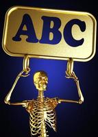 abc woord en gouden skelet foto