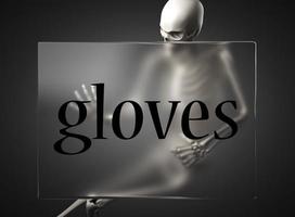 handschoenen woord over glas en skelet foto