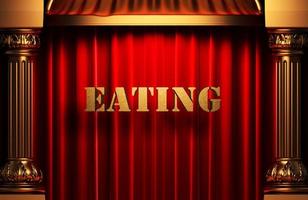 gouden woord eten op rood gordijn foto