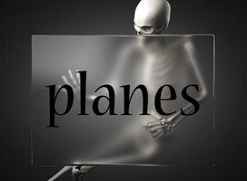 vliegtuigen woord op glas en skelet foto