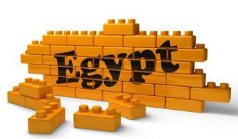 Egypte woord op gele bakstenen muur foto