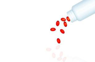 Giet rode zachte gel capsule pillen uit drug fles geïsoleerd op een witte achtergrond. rode zachte gelatinecapsule vitamines en voedingssupplementen. farmaceutische industrie. apotheek drogisterij. gezondheidszorg. foto
