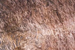 steen textuur achtergrond met uniek patroon. bruine en witte vuile rotstextuur. rots oppervlak abstracte achtergrond. natuursteen achtergrond. ruwe stenen vloer. grunge en roest rots textuur. foto