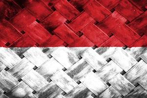 indonesië vlagscherm op rieten houten achtergrond foto