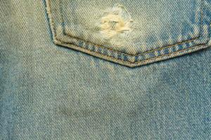 de blauwe spijkerbroek of blauwe denim schone textuur. foto