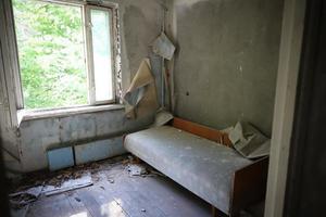 kamer van een gebouw in de stad Pripyat, de uitsluitingszone van Tsjernobyl, Oekraïne foto