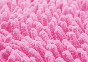 close-up van de textuur van de roze tapijtstof voor achtergrondgebruik foto