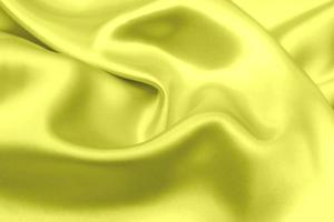 gele satijnen stof textuur zachte achtergrond foto