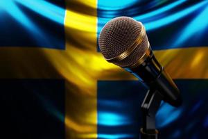 microfoon op de achtergrond van de nationale vlag van zweden, realistische 3d illustratie. muziekprijs, karaoke, radio en geluidsapparatuur voor opnamestudio's foto