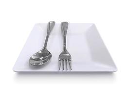 lepel, vork en bord geïsoleerd op witte achtergrond foto