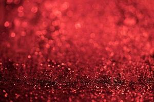 rode glitter bokeh lichten wazig abstracte achtergrond voor Valentijnsdag, verjaardag, jubileum, bruiloft, nieuwjaar en Kerstmis foto