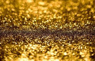 gouden glitter bokeh verlichting textuur wazig abstracte achtergrond voor verjaardag, jubileum, bruiloft, oudejaarsavond of kerst foto