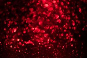 rode glitter bokeh lichten wazig abstracte achtergrond voor Valentijnsdag, verjaardag, jubileum, bruiloft, nieuwjaar en Kerstmis foto