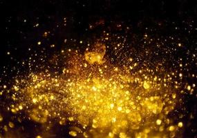 gouden glitter bokeh verlichting textuur wazig abstracte achtergrond voor verjaardag, jubileum, bruiloft, oudejaarsavond of kerst foto