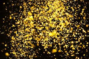 gouden glitter bokeh verlichting textuur wazig abstracte achtergrond voor verjaardag, jubileum, bruiloft, oudejaarsavond of kerst foto