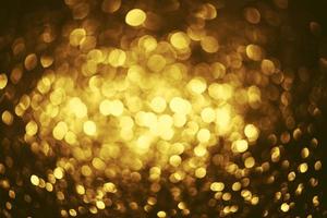 gouden glitter bokeh verlichting textuur wazig abstracte achtergrond voor verjaardag, jubileum, bruiloft, oudejaarsavond of kerst foto