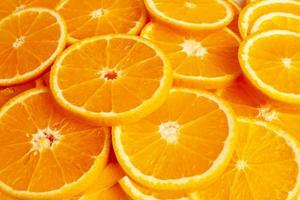 achtergronden en textuur van oranje fruit in stukjes foto