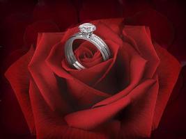 elegante diamanten ring op een roze bloem op de achtergrond van mooie rode rozenblaadjes foto
