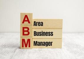 abm gebied business manager symbool. concept woorden abm gebied business manager op houten blokken foto
