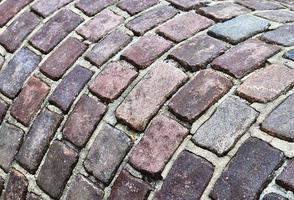 gedetailleerde close-up op oude historische geplaveide wegen en voetpaden foto