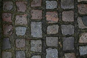 gedetailleerde close-up op oude historische geplaveide wegen en voetpaden foto