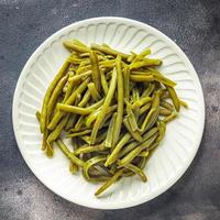 sperziebonen gekookte boon klaar om te eten verse gezonde maaltijd voedsel snack dieet op tafel kopieer ruimte voedsel achtergrond rustieke bovenaanzicht foto