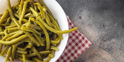 groene boon ingeblikte gekookte bonen klaar om te eten verse gezonde maaltijd voedsel snack dieet op tafel kopieer ruimte voedsel achtergrond rustieke bovenaanzicht foto