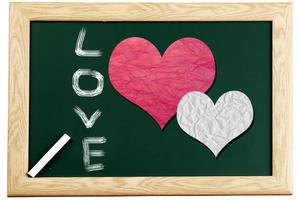 schoolbord met liefdeshartbericht geschreven met krijt foto