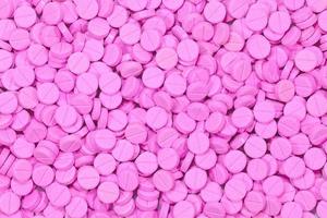 close-up van roze medische tabletten foto
