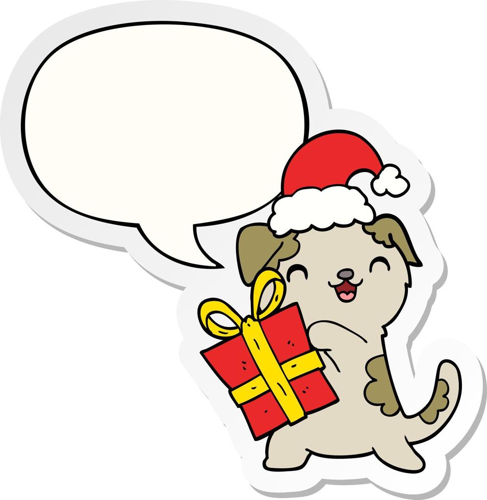 schattige cartoon puppy en kerstcadeau en hoed en tekstballon sticker vector