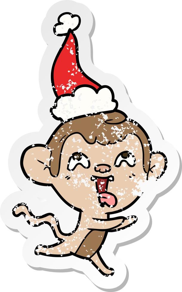 gekke verontruste sticker cartoon van een aap die rent met een kerstmuts vector