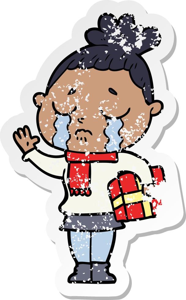 verontruste sticker van een cartoon huilende vrouw met kerstcadeau vector
