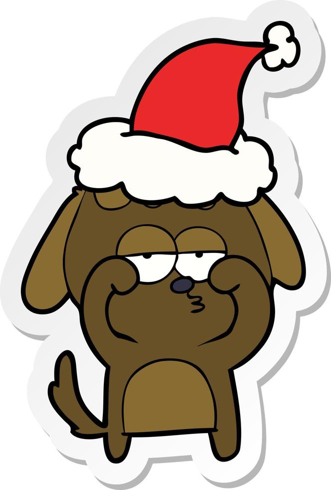 sticker cartoon van een vermoeide hond met een kerstmuts vector