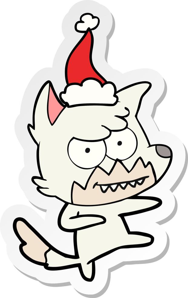 sticker cartoon van een grijnzende vos met een kerstmuts vector