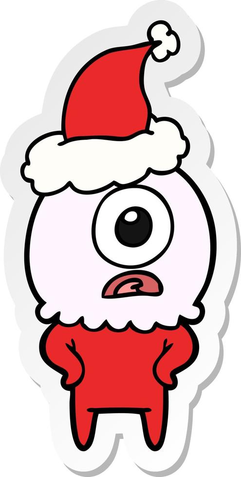 sticker cartoon van een cyclops buitenaardse ruimtevaarder met een kerstmuts vector