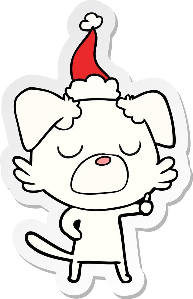 sticker cartoon van een hond met een kerstmuts vector