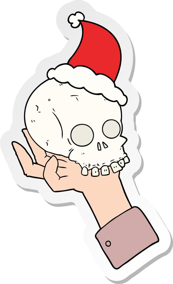 sticker tekenfilm van een hand- Holding schedel vervelend de kerstman hoed vector