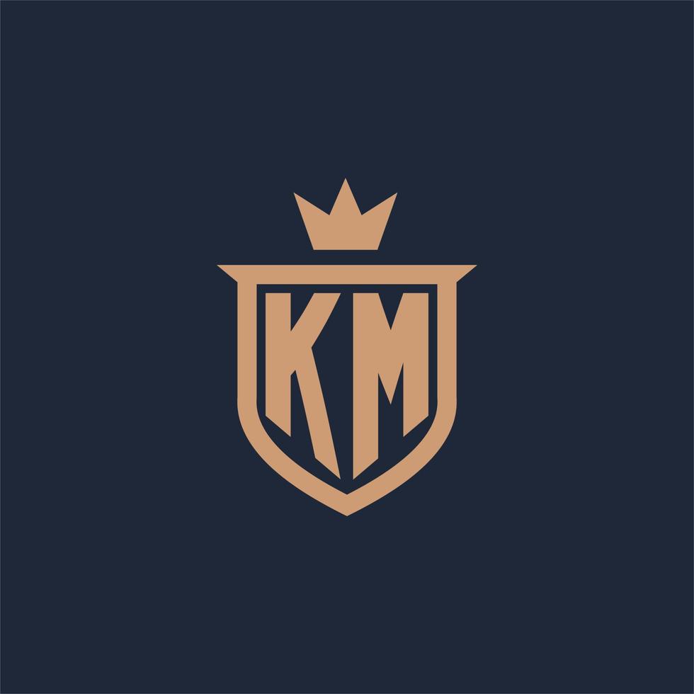 km monogram eerste logo met schild en kroon stijl vector