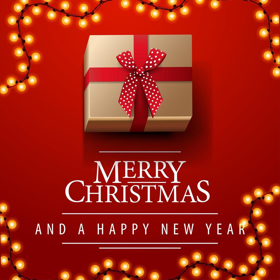 prettige kerstdagen en gelukkig nieuwjaar, rode vierkante ansichtkaart met slinger en heden met strik, bovenaanzicht vector