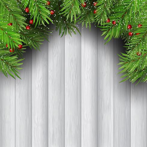Kerstboomtakken op houten achtergrond vector