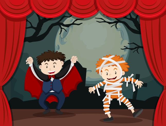 Twee jongens in halloween-kostuum op het podium vector