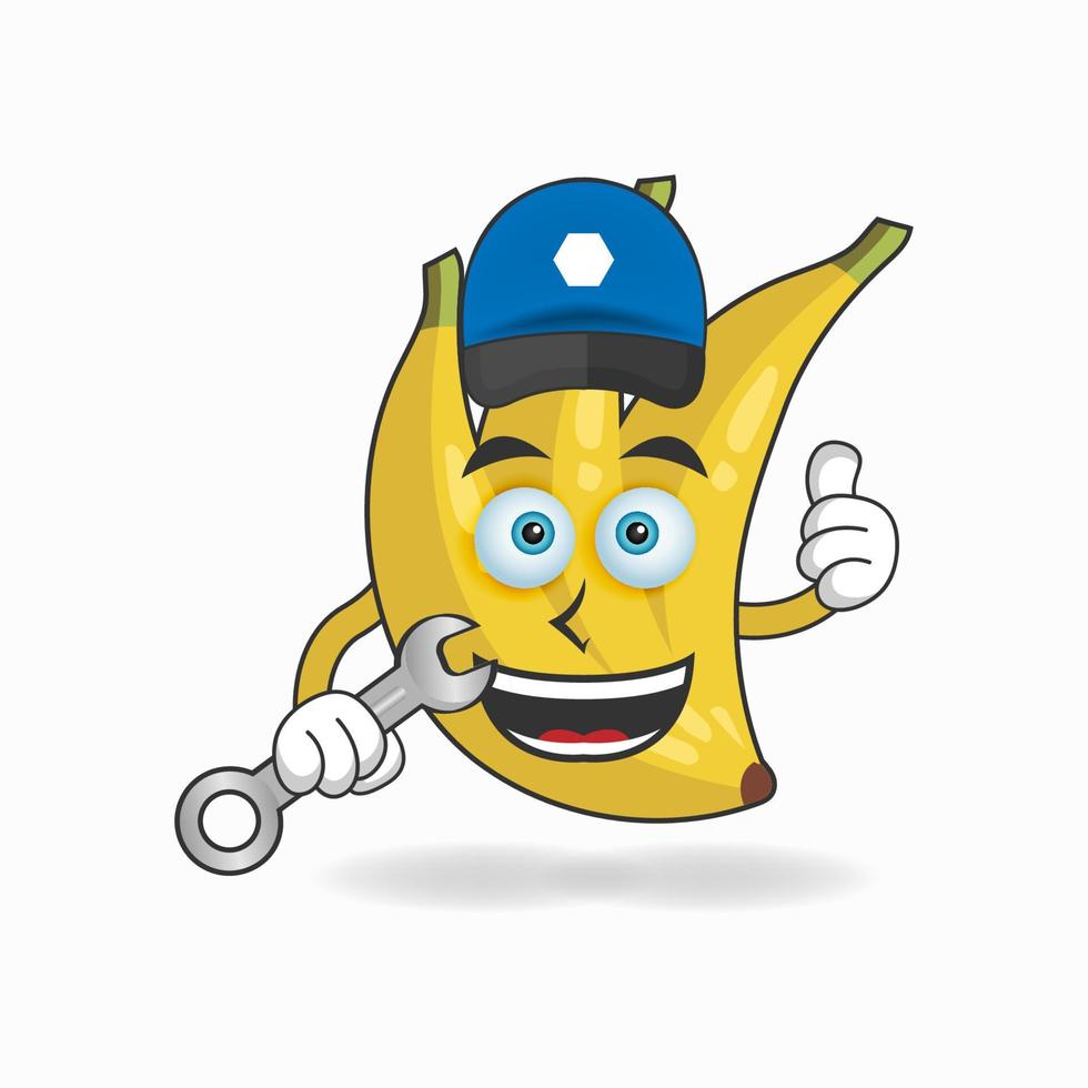 het karakter van de banaanmascotte wordt een monteur. vector illustratie
