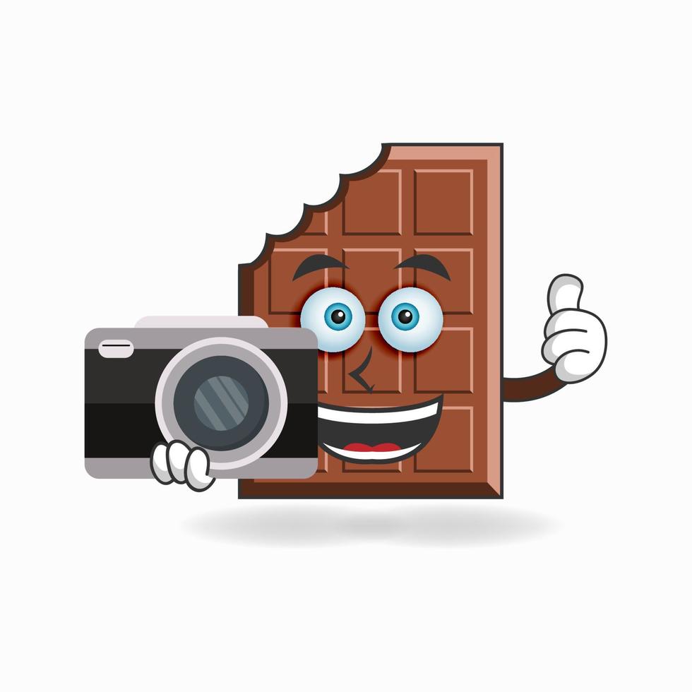 chocolade mascotte karakter met camera. vector illustratie