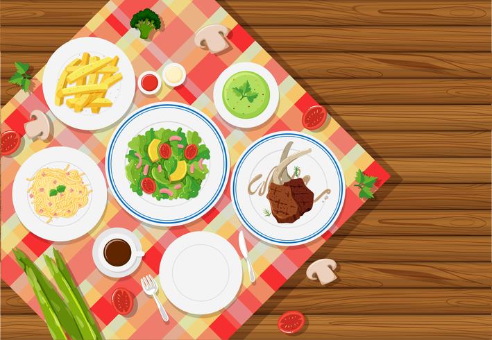 Achtergrondmalplaatje met voedsel op tafelkleed vector