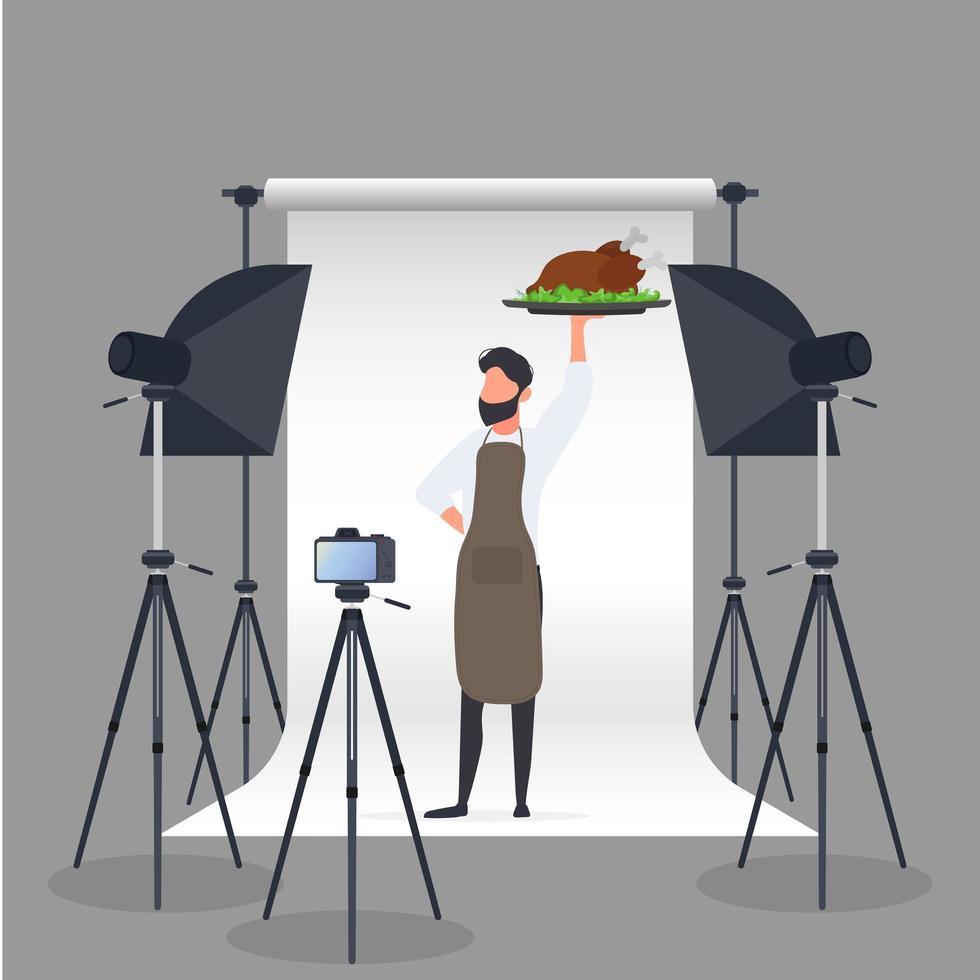 culinaire blogger. een man in een keukenschort houdt een gebakken kip op een dienblad. camera op statief, softbox. culinair blog of vlog-concept. vector. vector
