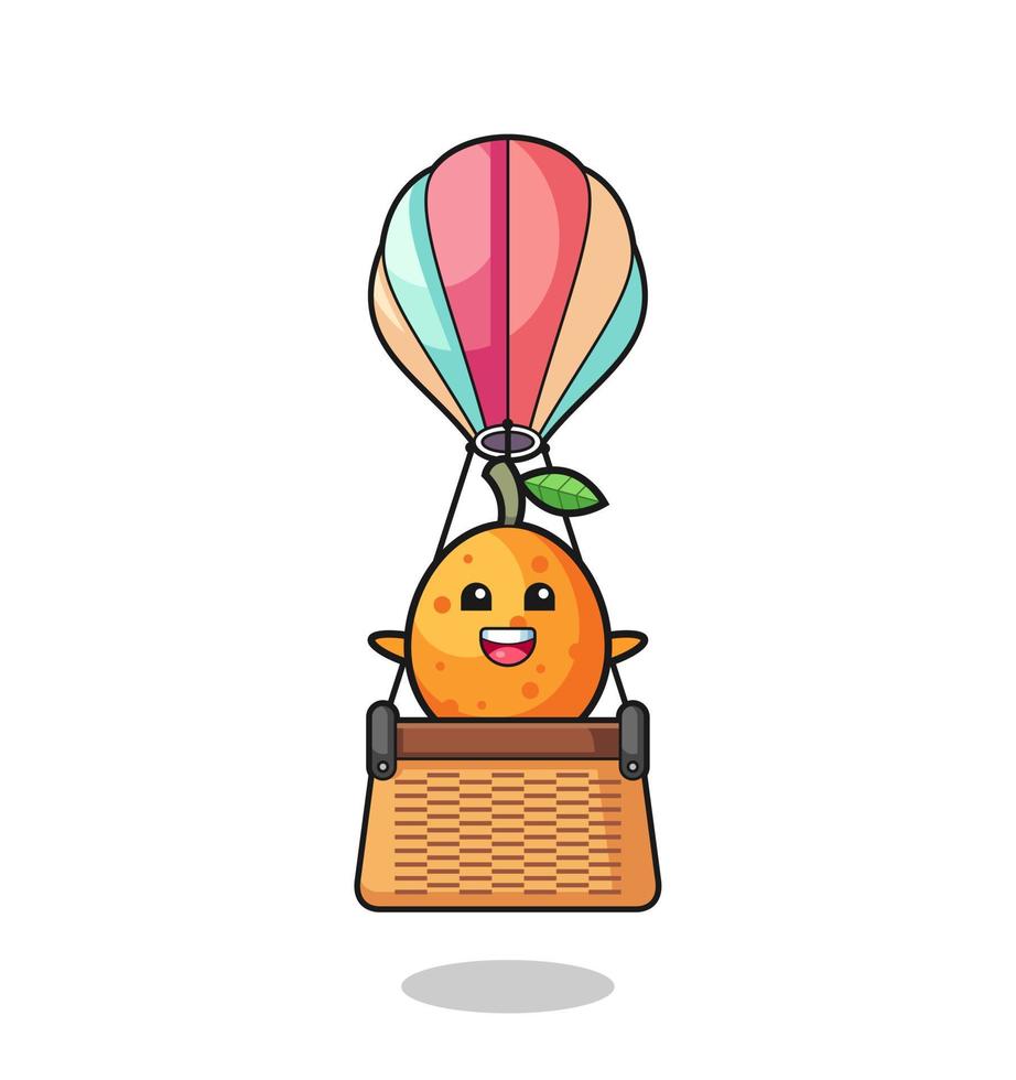 Kumquat-mascotte rijdt in een heteluchtballon vector