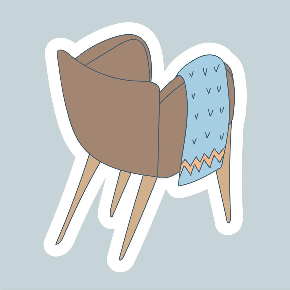 gezellige fauteuil met een deken in scandinavische stijl. europese meubels en woondecoratie. winterhygge. hand getekend lineaire cartoon afbeelding op witte achtergrond. sticker ontwerp vector