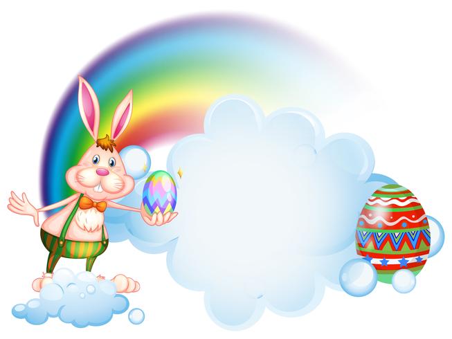 Een konijntje dat een ei houdt dichtbij de regenboog vector