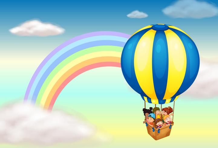 Een heteluchtballon in de buurt van de regenboog vector