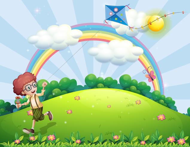 Een jongen speelt met zijn vlieger op de heuveltop met een regenboog vector